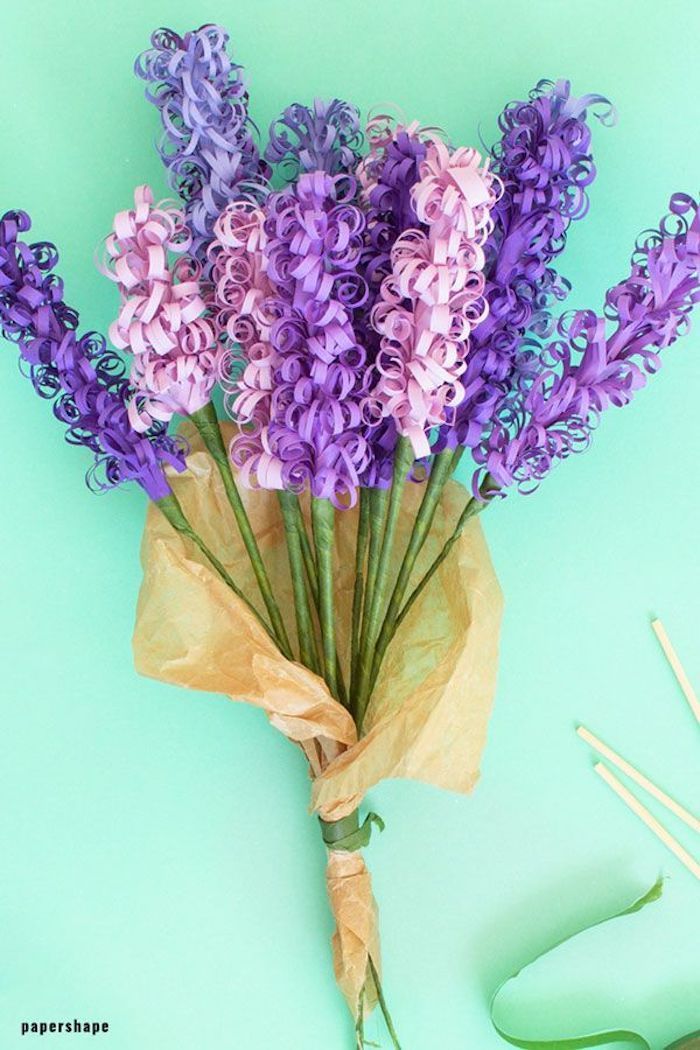 hyacinth flowers made of paper, arranged in a bouquet, how to make paper flowers, placed on green surface