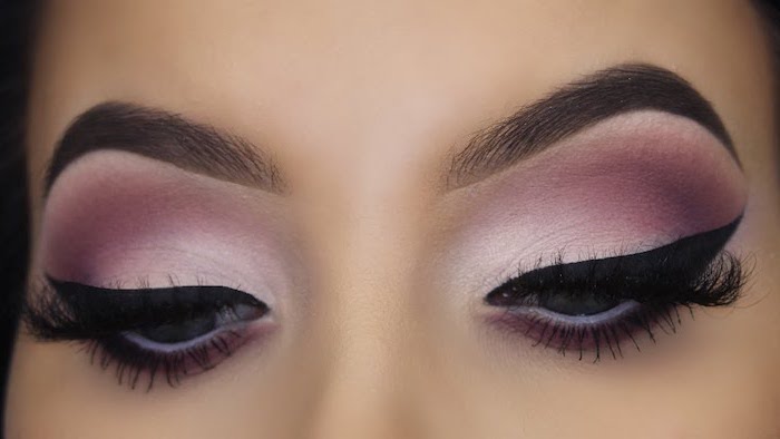 pink and purple white eyeshadow colors, black cat eyeliner, makeup for beginners, woman with thick dark eyebrows