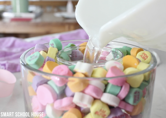 small vase filled with water, large vase filled with conversation hearts, valentines day gifts, step by step diy tutorial