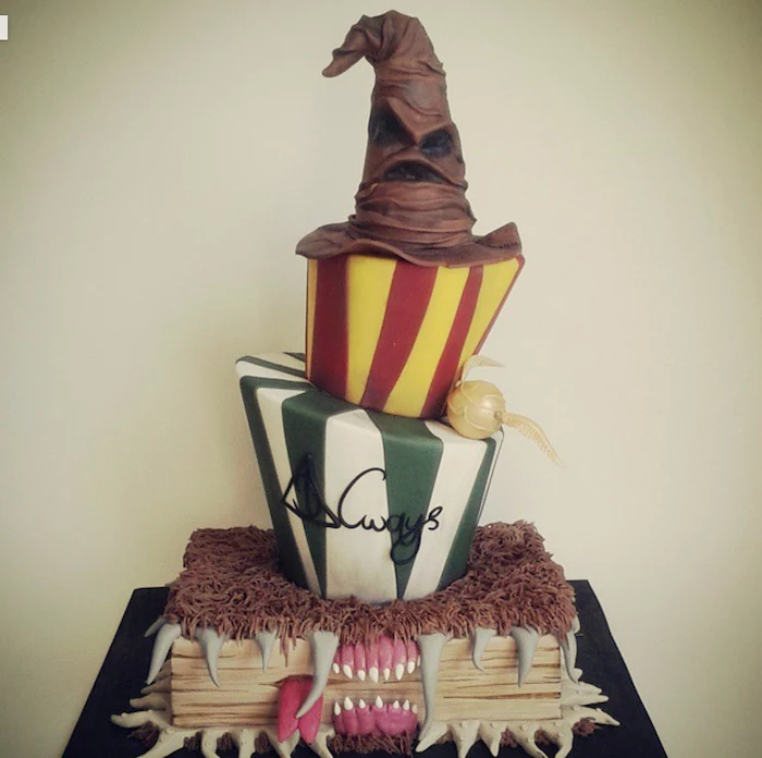 the monster books of monsters bottom layer, slytherin and gryffindor layers, sorting hat on top, easy harry potter cake