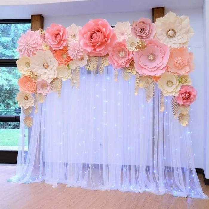 giant paper flower template, white tulle with fairy lights, large paper flowers on top, different shapes and sizes