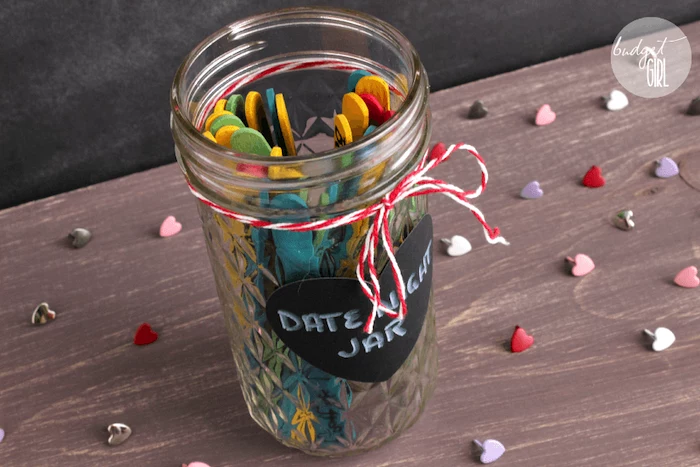 mason jar filled with date ideas, written on popsicle sticks, valentines day gifts, date night jar, placed on wooden surface