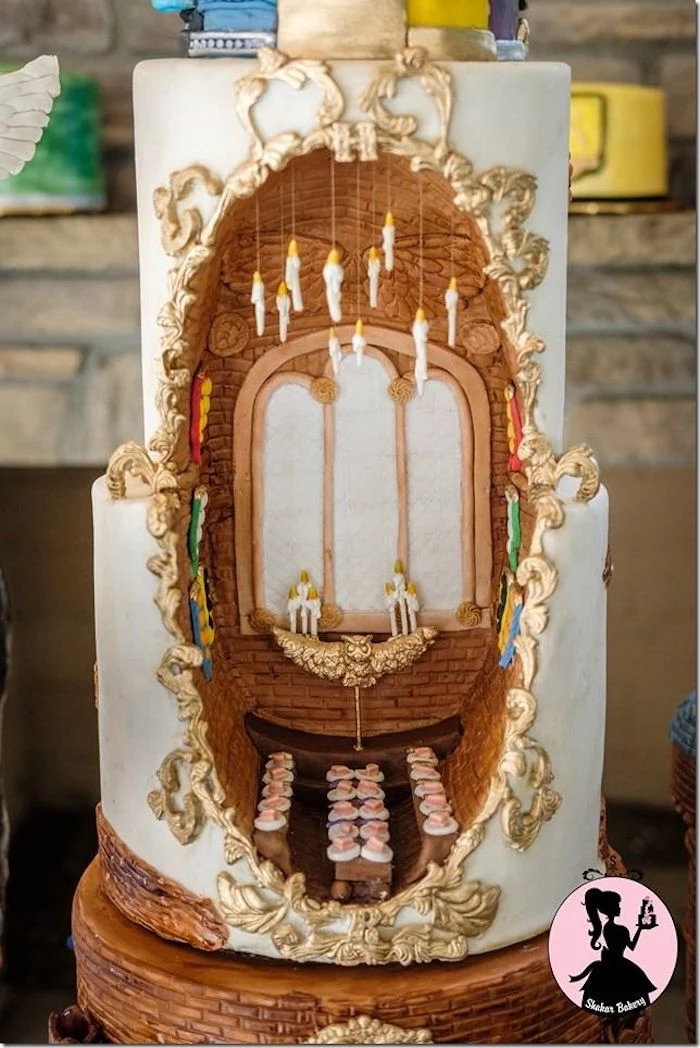 two tier cake, inside taken out, the great hall portrayed in the middle, diy harry potter cake, candles hanging made of fondant