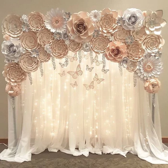 white tulle with fairy lights, rose gold and white paper flowers on top, giant paper flower template, different shapes and sizes