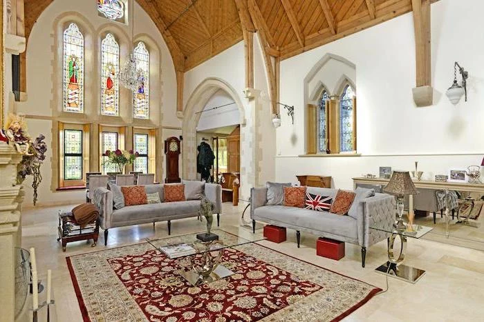 vintage style living room, cathedral ceiling and windows, how to make stained glass windows, grey velvet sofas
