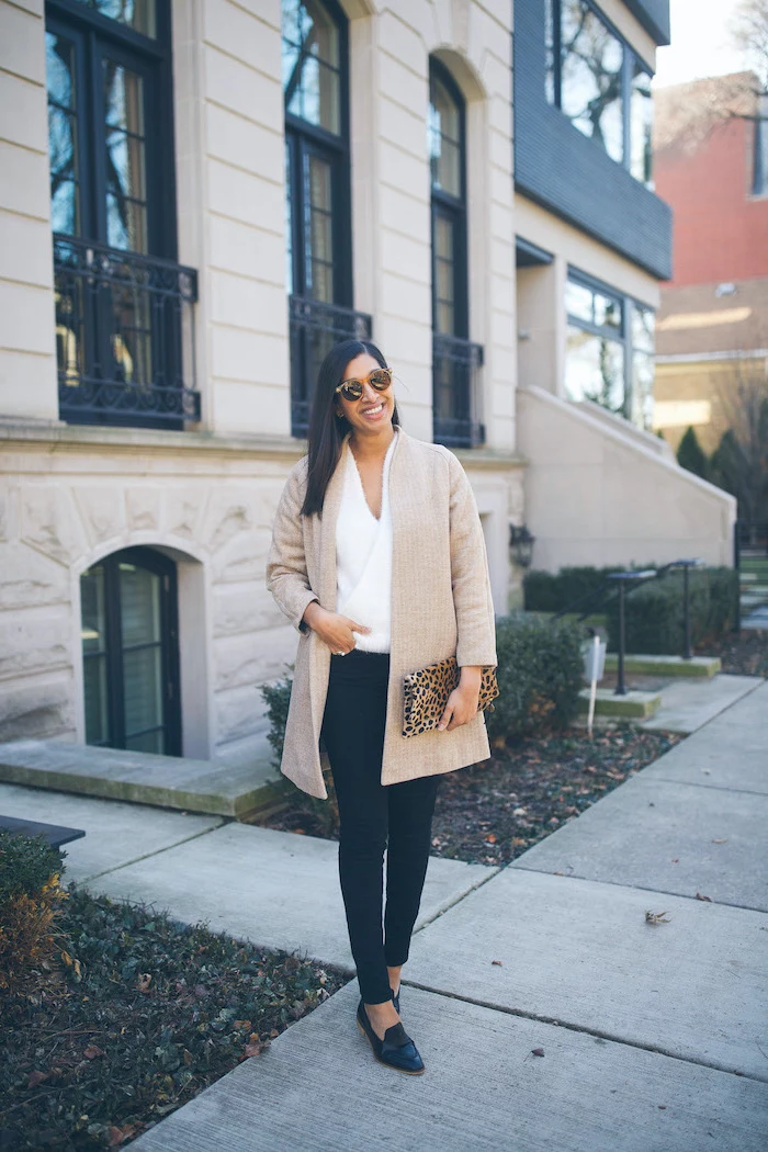cute valentines day outfits, woman standing on sidewalk, wearing black pants and white blouse, nude cardigan