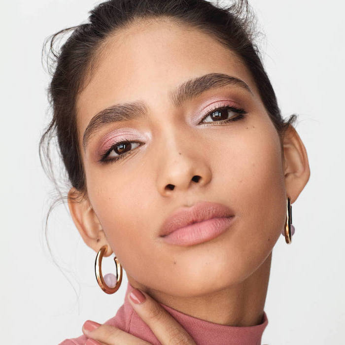 woman with brown eyes and hair, gold smokey eye, nude pink eyeshadow colors, nude lipstick, small hoop earrings