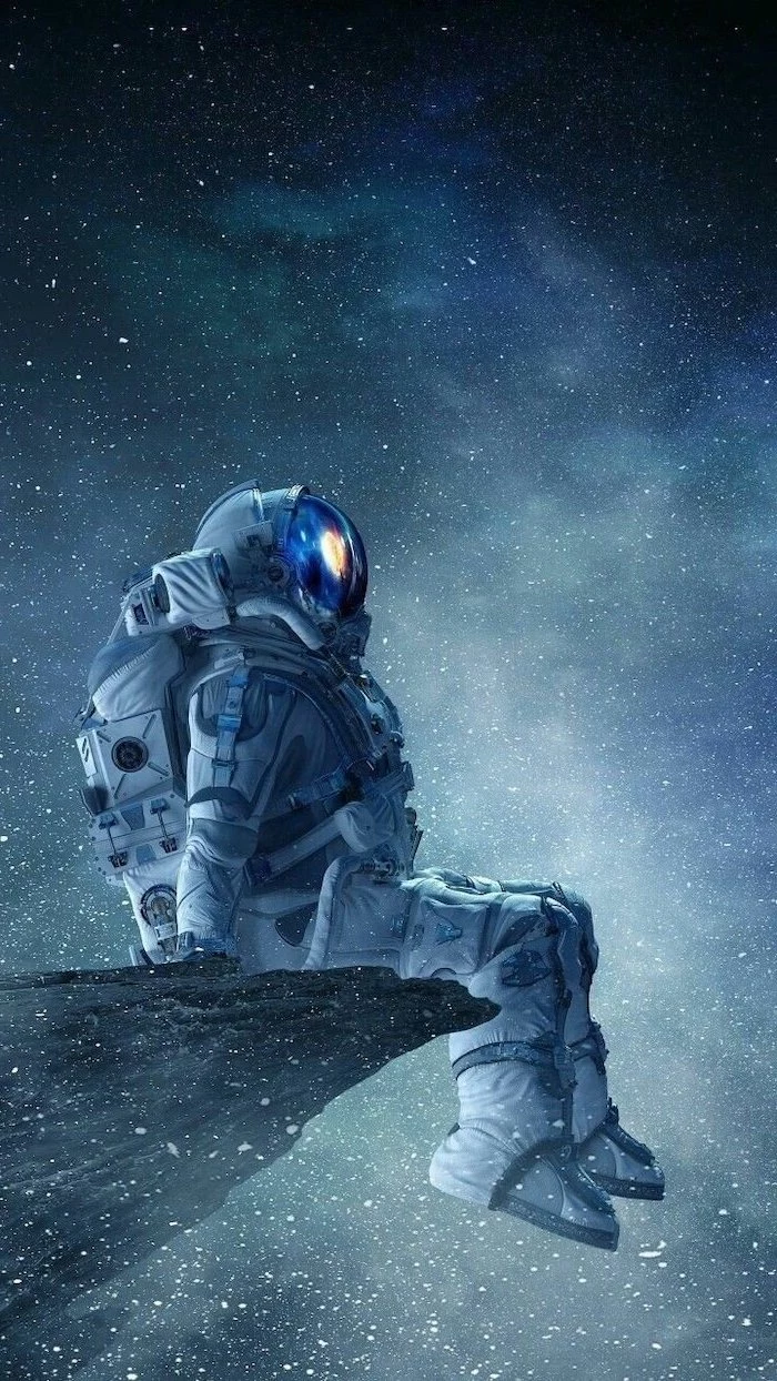 astronaut in a suit, sitting on the edge of a rock, galaxy wallpaper, starring into space, sky filled with stars