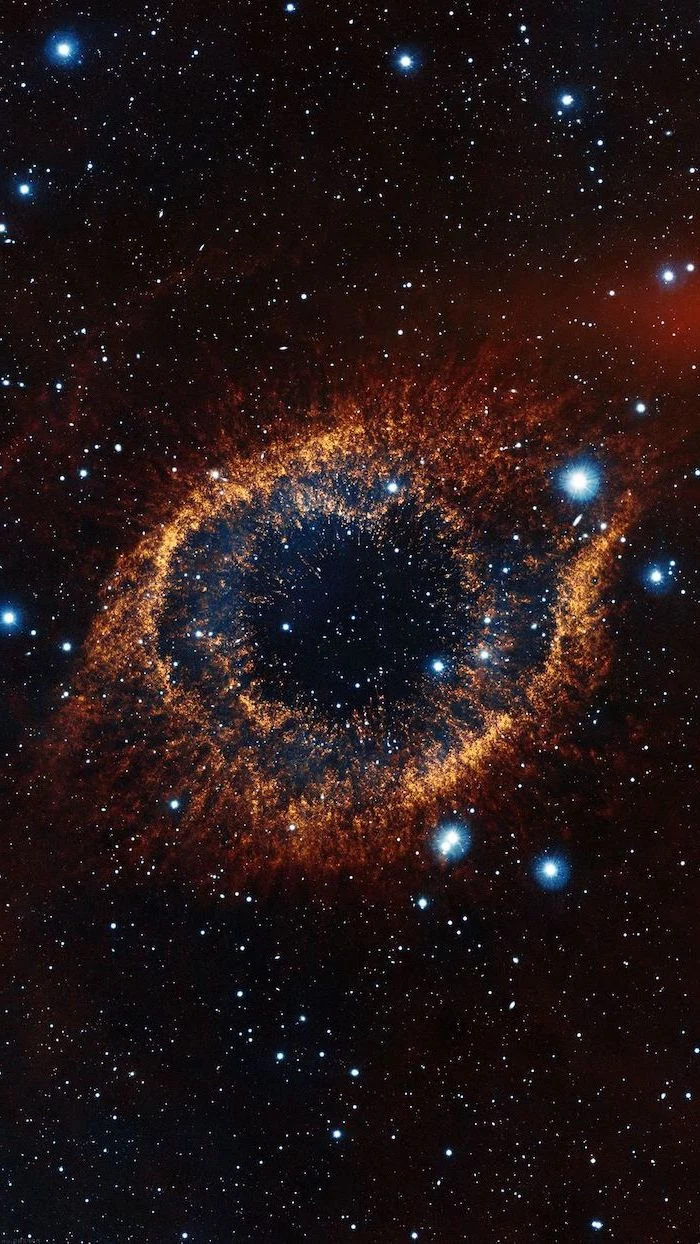 sky filled with stars, galaxy wallpaper, black sky with eye shaped galaxy in the middle, orange blue and red colors