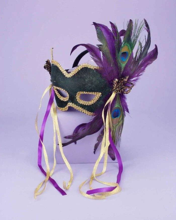 black mask with gold decorations, masquerade masks for women, decorated with purple and green peacock feathers