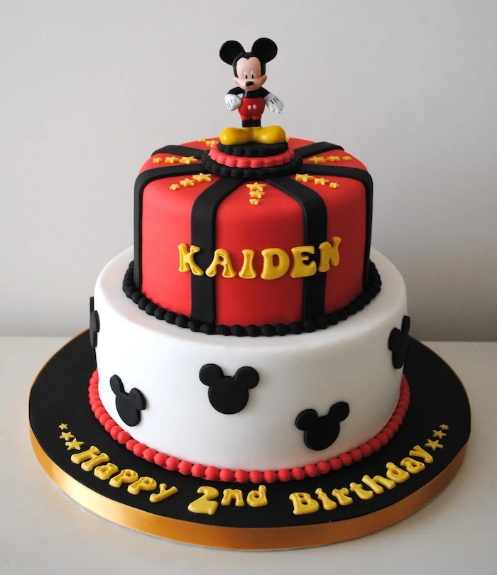 two tier cake, covered with red white and black fondant, mickey mouse cake, mickey cake topper