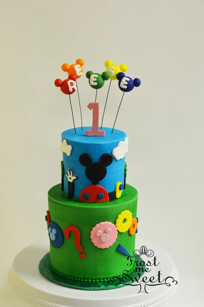 mickey mouse birthday cake, two tier cake, covered with blue and green fondant, mickey cake pops for cake toppers