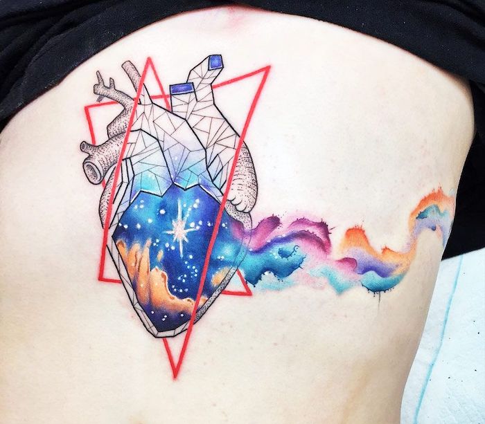 rib cage tattoo, heart inside triangles, galaxy inside the heart, moon and stars tattoo, blue purple pink and orange colors