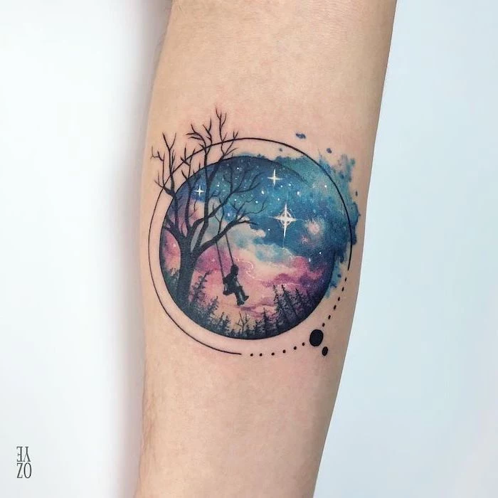 forearm tattoo, girl swinging on a swing hanging from tree, moon and stars tattoo, galaxy in the background with stars