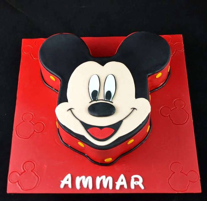 mickey mouse 1st birthday cake, cake in the shape of mickey's head, decorated with black white and red fondant
