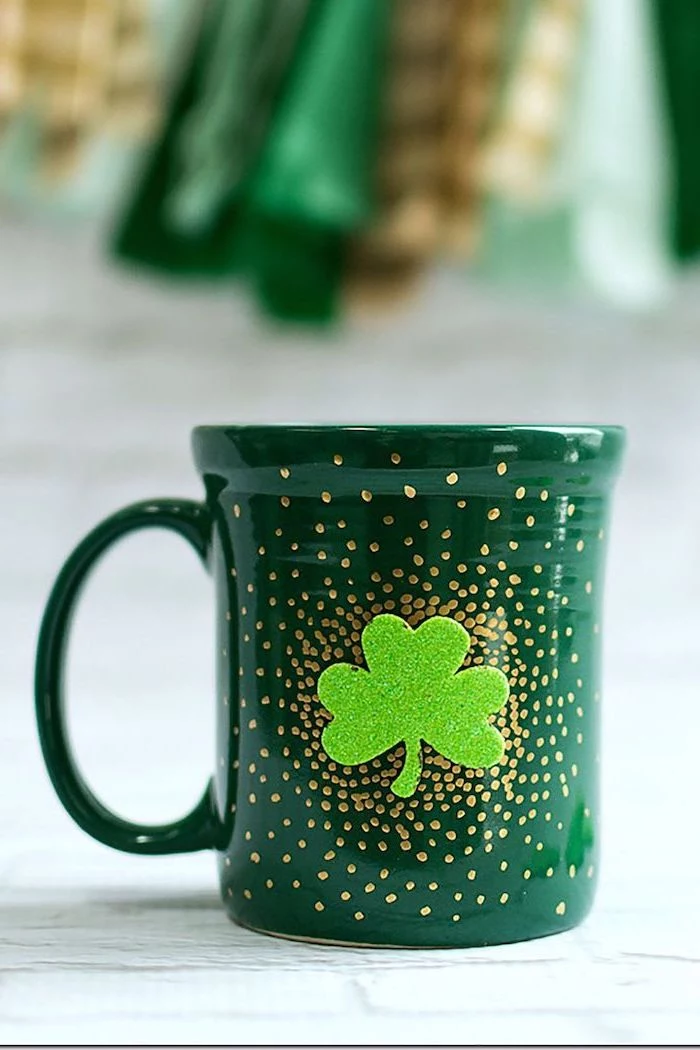 coffee mug painted in green, gold dots all over it, st patrick's day accessories, green glitter shamrock in the middle