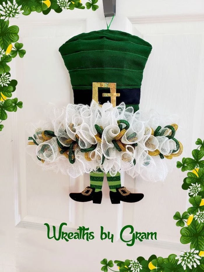 wreath made with white gold and green glitter, st patrick's day party, green hat and elf's feet, hanging on white door