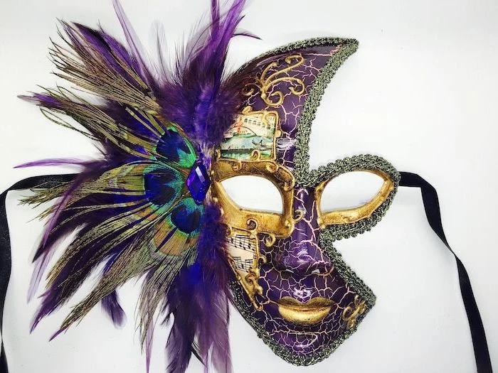 purple mask with gold decorations, male masquerade masks, purple and green peacock feathers, black ribbons