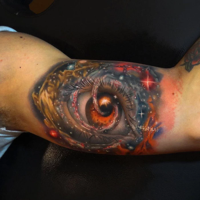 eye in the middle of space, surrounded by stars in different colors, space tattoo ideas, inside arm tattoo