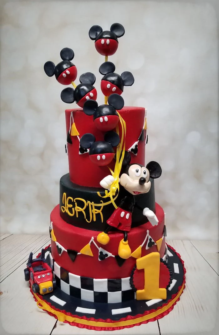 three tier cake, covered with red black and white fondant, mickey cake, mickey cake pops cake toppers