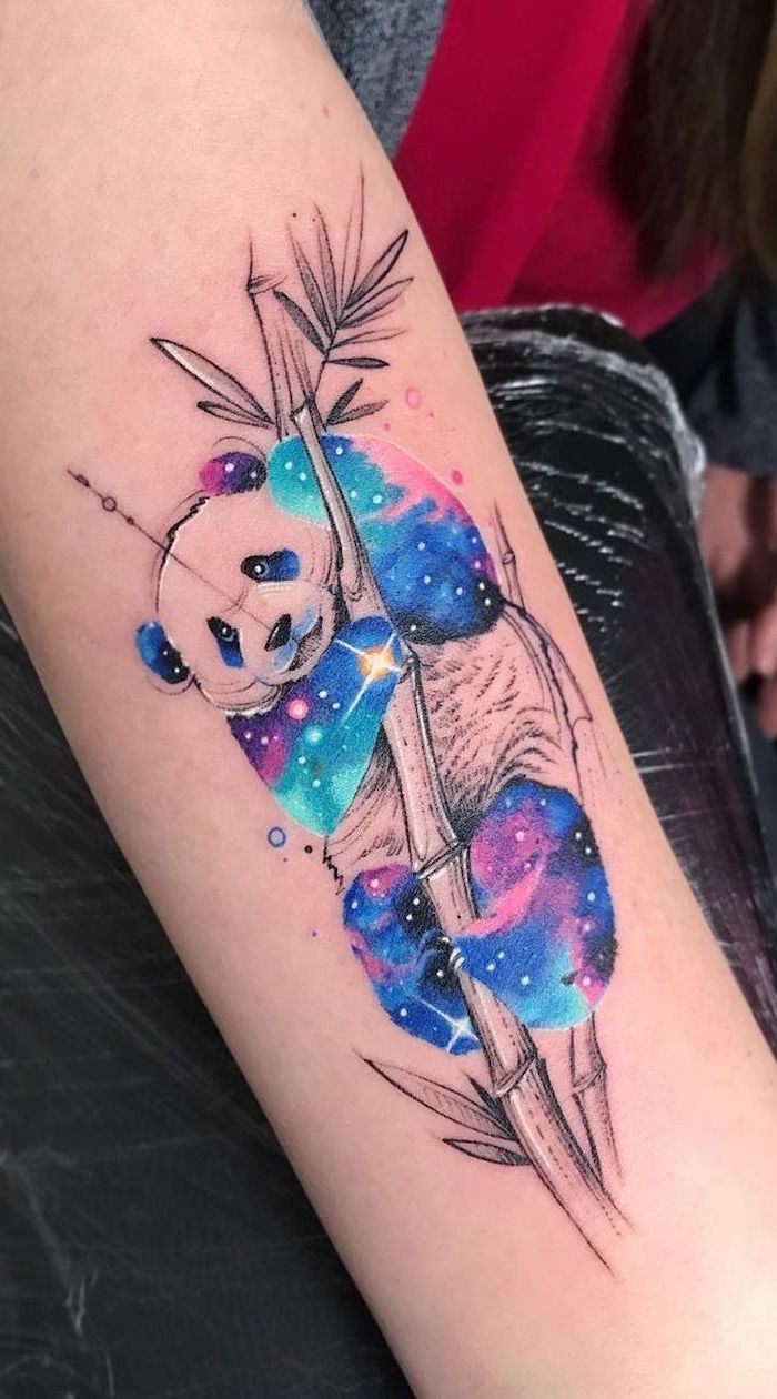 panda holding onto a bamboo tree, space themed tattoos, galaxy colors on the panda, forearm tattoo