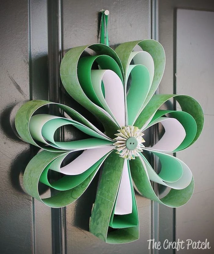 paper shamrock, made with white and green paper, st patricks decor, hanging on black wooden door