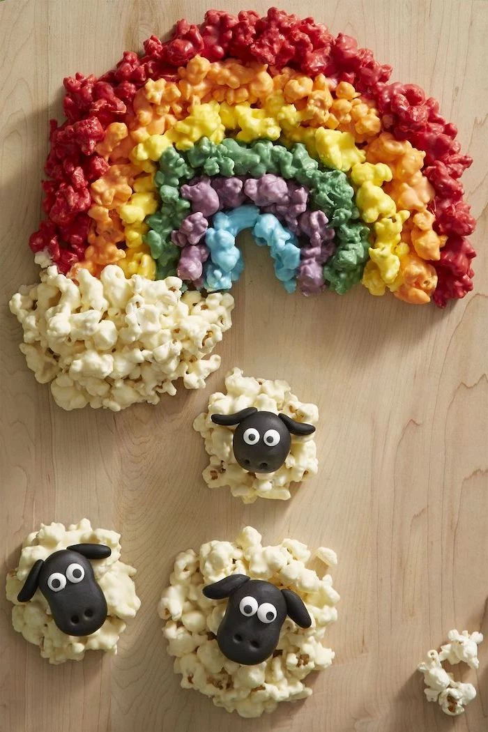 popcorns arranged as a rainbow, st patrick's day crafts, popcorn sheep, arranged on a wooden surface