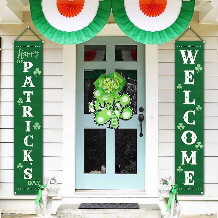 wooden door with shamrock wreath, st patrick's day party ideas, two green banners on both sides