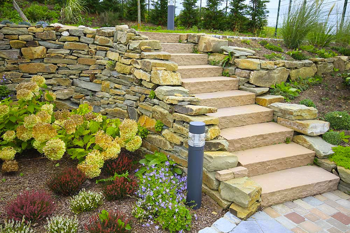 staircase-with-small-gardens-on-the-side-natural-stone-and-reclaimed-setts-bushes-of-yellow-purple-and-red-bushes small garden staircase, made with stones, small gardens on both sides, natural stone and reclaimed setts