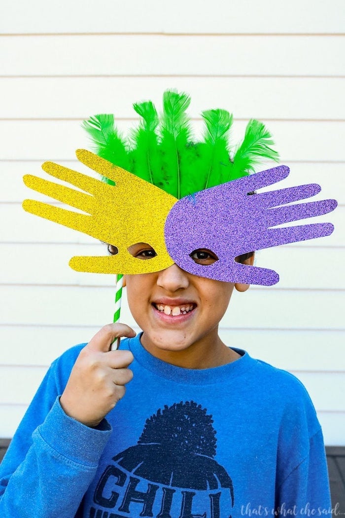 step by step diy tutorail, masks made of handprints, masquerade ball masks, boy wearing the mask