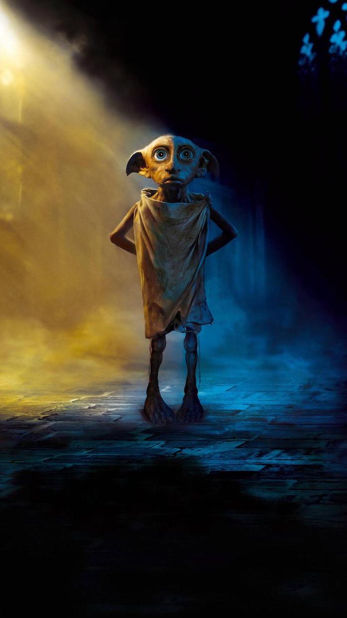 dobby the house elf, standing in a dark lit hallway, cute harry potter wallpaper, dark blue and yellow aesthetic