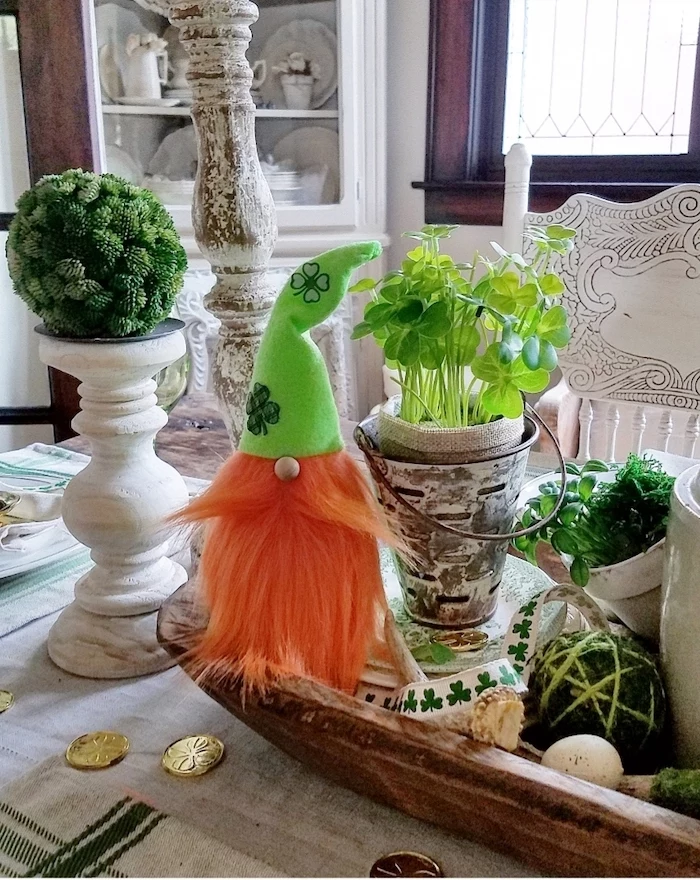 pots with green plants, arranged on plate, st patricks day games, gold coins scattered around, elf toy with ginger beard