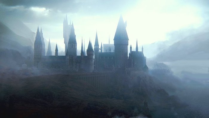 the entire hogwarts castle, surrounded by fog, harry potter iphone wallpaper, mountain landscape around it