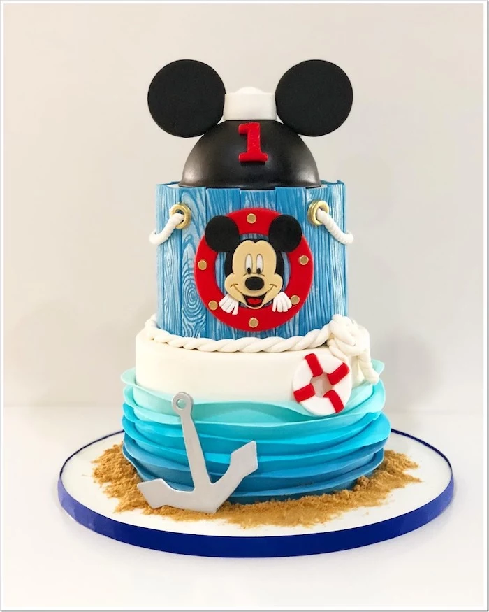 nautical themed cake, mickey mouse cake pan, two tier cake, covered with blue white and black fondant