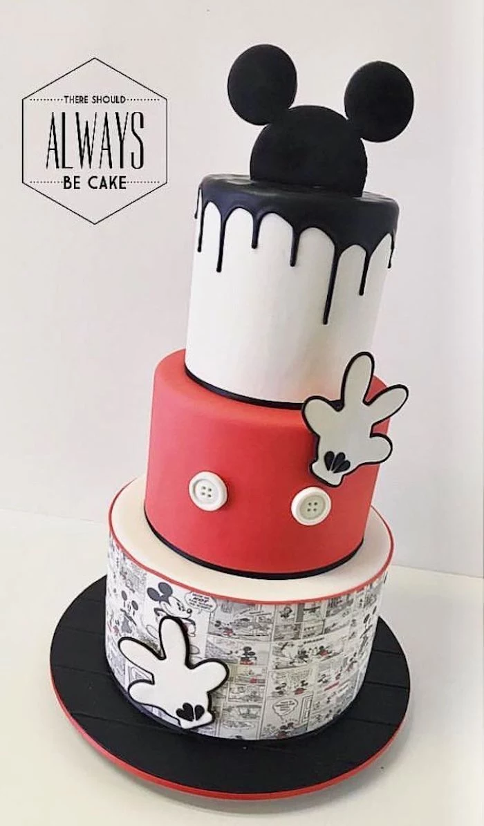 three tier cake, covered with white and red fondant, black fondant dripping on the sides, mickey mouse cake pan