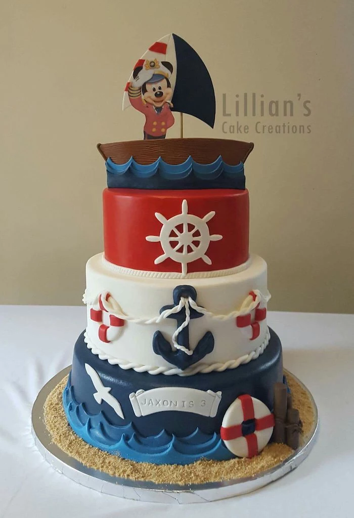 nautical themed cake, mickey cake, three tier cake, covered with blue white and red fondant, mickey cake topper