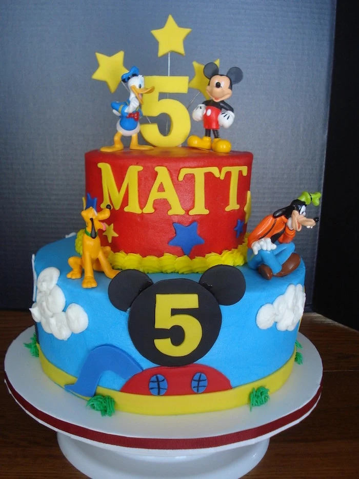 mickey mouse cake decorations, two tier cake, covered with red and blue fondant, disney characters decorations on it