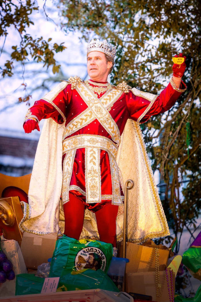 will ferrel as king bacchus, masquerade masks, dressed in red and gold costume, crown on his head