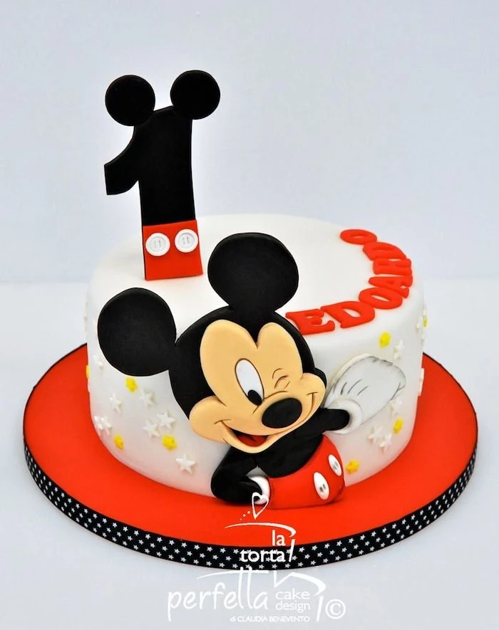 mickey mouse baby shower cake, one tier cake, covered with white fondant, placed on red cake tray