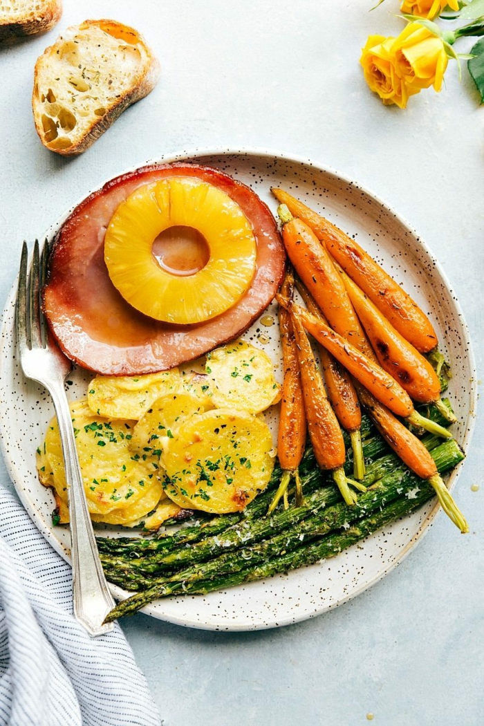 baked ham slice with pineapple, easter dishes, roasted carrots and asparagus, creamy potatoes on the side
