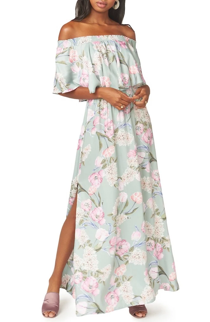 long blue dress with floral print, worn by brunette woman, easter dresses for women, white background