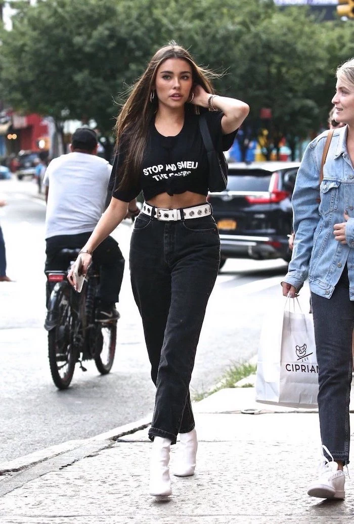 girl walking on the sidewalk, wearing all black outfit, cute outfits for school, black t shirt and trousers, white belt and boots
