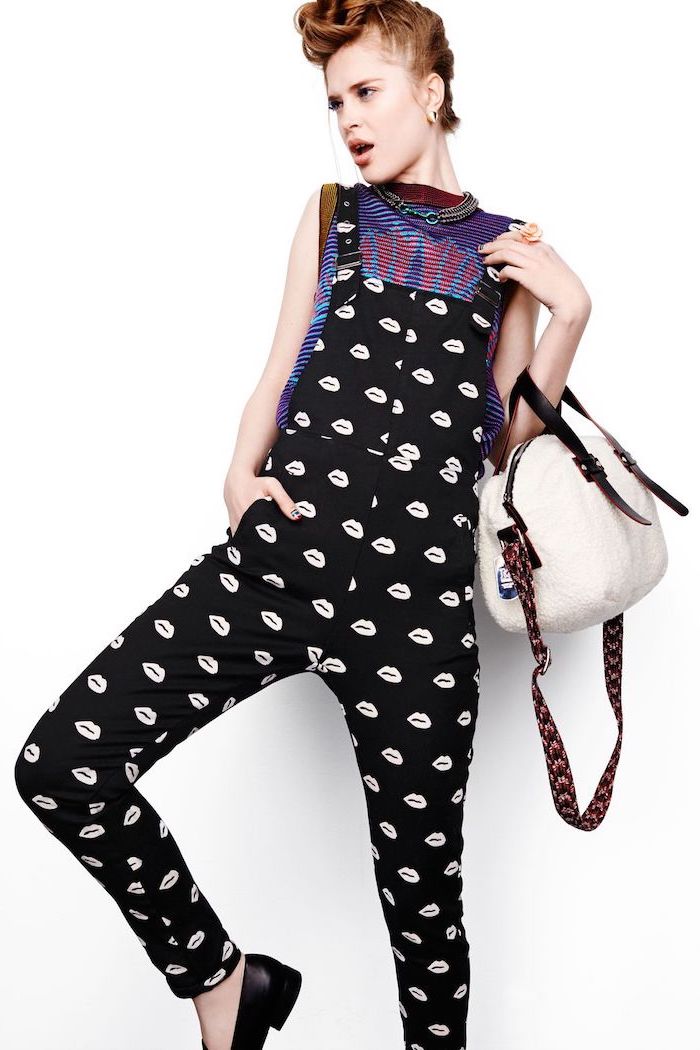 woman wearing black overalls with lips on them, colorful top and white bag, cute outfits for school, white background