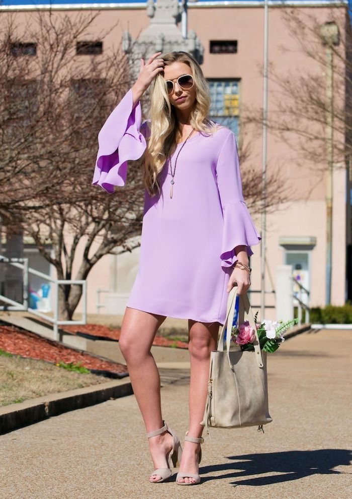 woman with long blonde wavy hair, standing on sidewalk, wearig purple dress with long sleeves, sundresses for women, nude heels