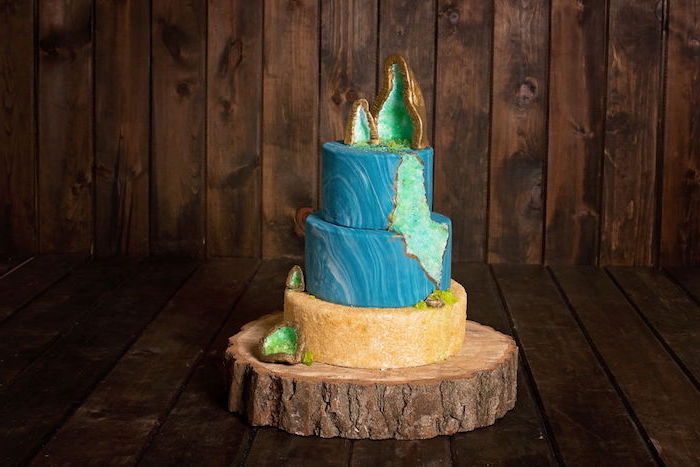 three tier cake, covered with blue marble and gold fondant, geo cake, decorated with turquoise rock candy