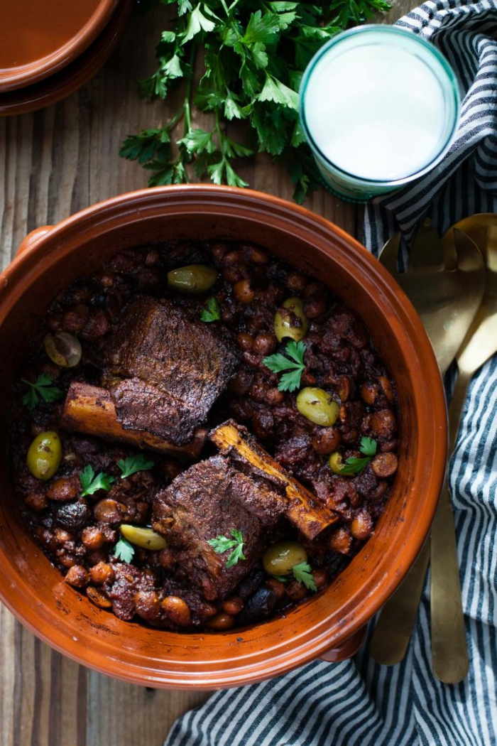 braised short rib, baked in ceramic bowl, dinner ideas for two, placed on wooden table, garnished with parsley