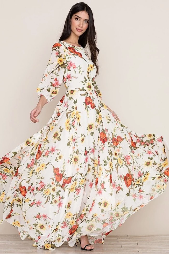 woman with long black hair, wearing a long white dress with floral print, black sandals, sunflower dress