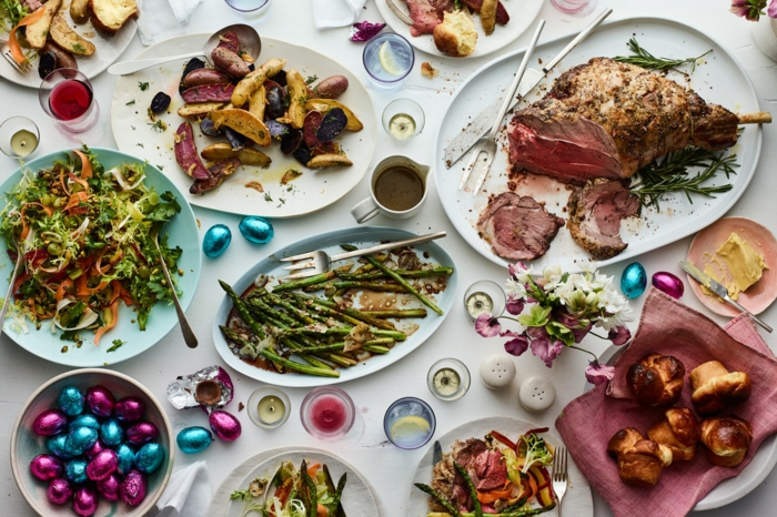 buffet table, easter lunch ideas, white plates filled with different meals, arranged on table with white cloth