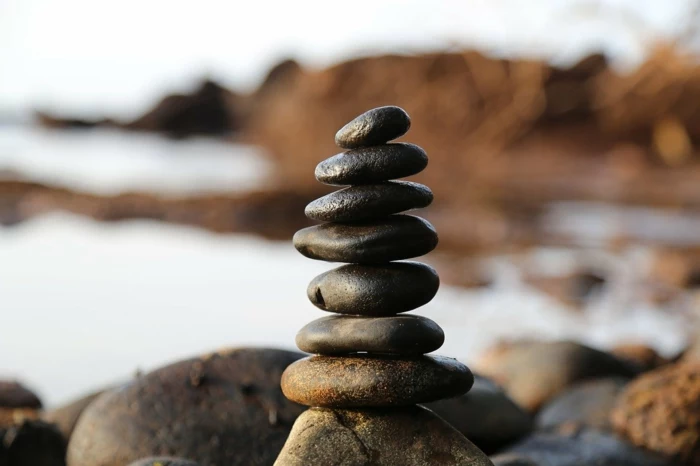 spa holidays, a bunch of rocks, stacked together on top of larger rocks, blurred background