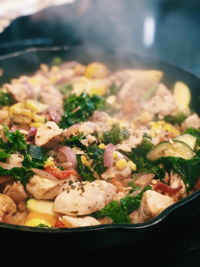chicken breast with kale, onion corn and cucumbers, what to cook for dinner tonight easy, cooked in black skillet